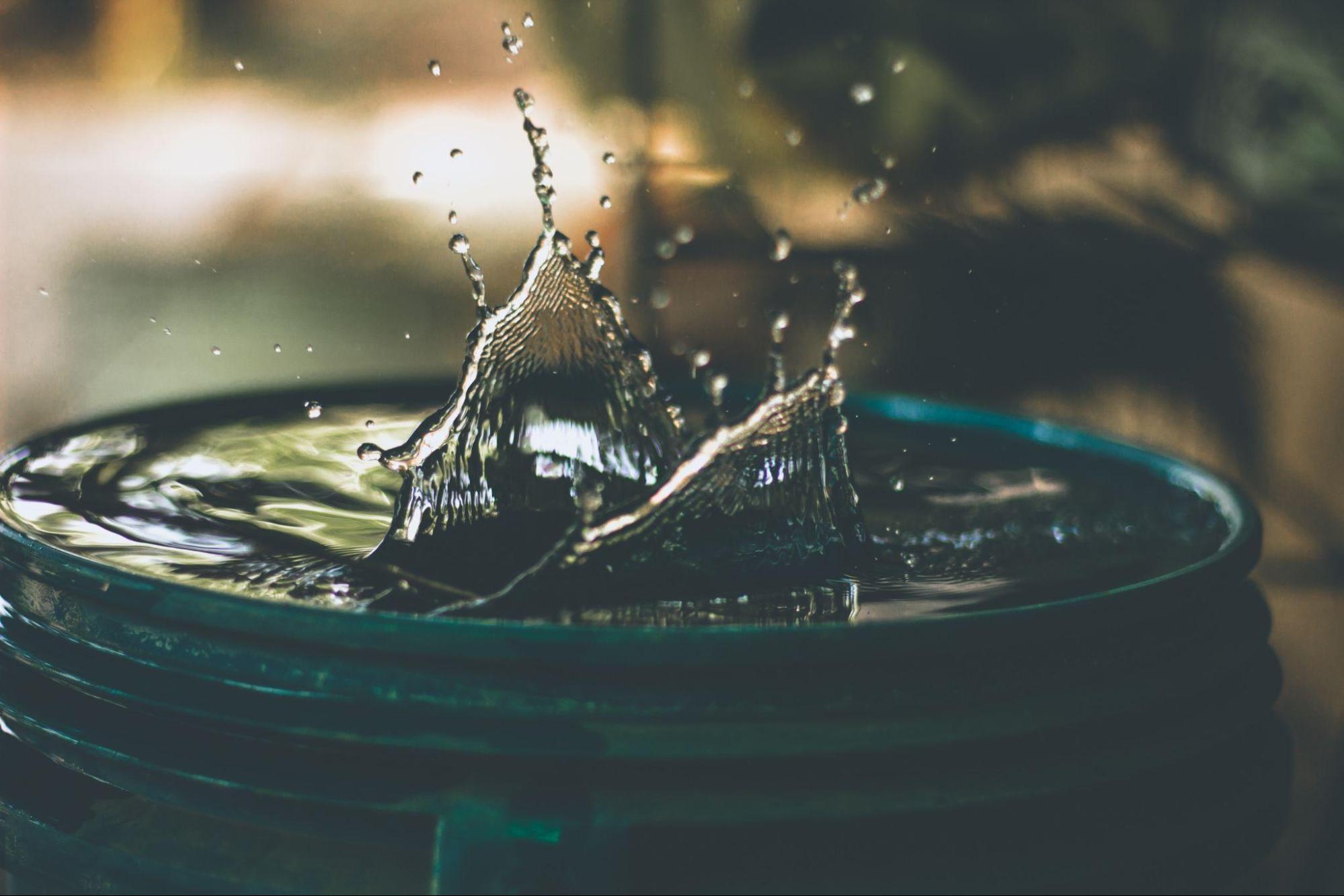  Fresh water splashing in a plastic barrel