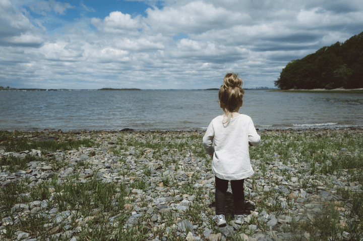 Child looking into the water